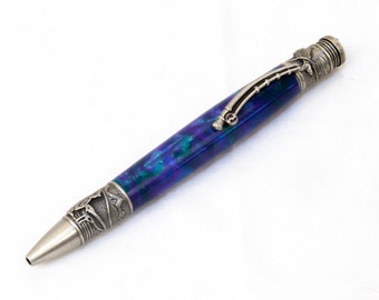 May include: A silver pen with a blue and green marbled design and a silver fishing rod detail on the top.