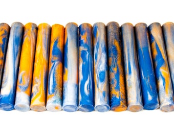 May include: A set of 12 acrylic pen blanks with a swirling blue, white, and orange marbled pattern.