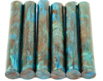 May include: Six round wooden dowels with a blue and brown marbled pattern.