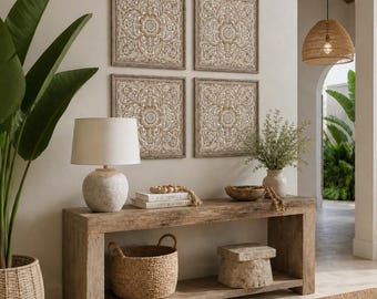 May include: Four square wooden wall panels featuring intricate carved floral patterns arranged in a grid. The light brown wood carvings are framed in matching square borders, creating a symmetrical display above a long wooden console table.