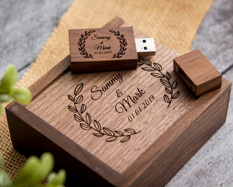 May include: A wooden box with a personalized engraved message, "Sammy & Mark 01.01.2019", and a matching engraved wooden USB drive.