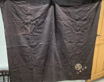 May include: A dark brown fabric curtain with a gold embroidered logo that says "平安" in Japanese characters. The curtain is hanging from a white rod.