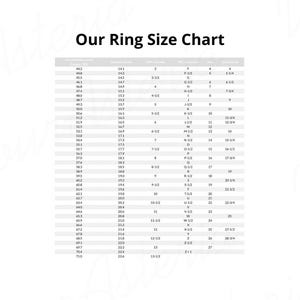 May include: A black and white ring size chart featuring the title Our Ring Size Chart at the top. The table displays columns for circumference in millimeters, diameter in millimeters, and various international ring sizing standards including USA and Canada.