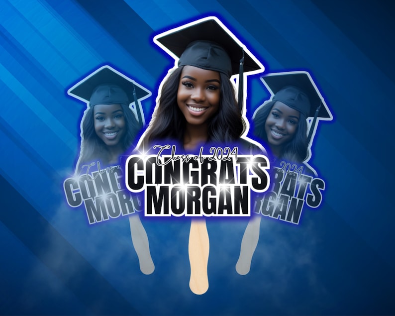 May include: A graduation fan featuring a smiling woman wearing a graduation cap. The fan has the text "Congrats Morgan" and "Class of 2024" in white and black. The background is blue with diagonal stripes.