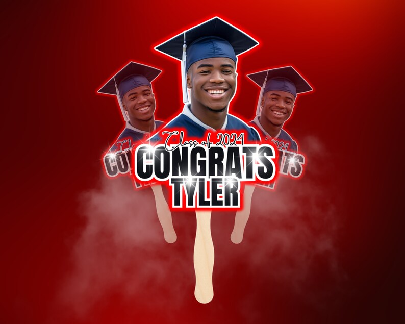 May include: A graduation fan featuring a smiling young man in a cap and gown. The fan reads "Congrats Tyler" with "Class of 2024" above. The background is a gradient of red.