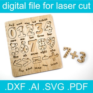 May include: A wooden laser cut puzzle featuring numbers 0-9 with stars inside each number. The puzzle also includes math symbols and equations. The text "3+5=8" is visible on the puzzle.