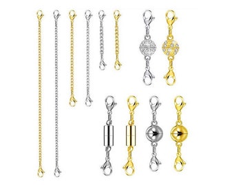 May include: Assortment of gold and silver magnetic clasps for necklaces and bracelets.  The clasps feature different styles, including a round ball with clear rhinestones, a cylinder, and a round ball.