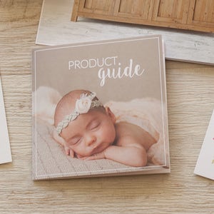 May include: A product guide booklet with a photo of a baby girl wearing a white headband with a flower on it. The text on the cover reads "PRODUCT. guide".