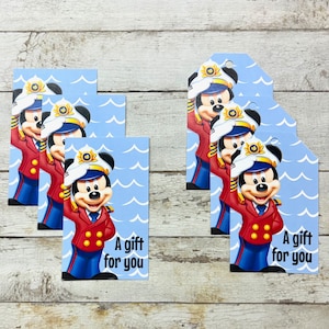 May include: Set of six blue and white gift tags featuring a cartoon image of Mickey Mouse dressed as a sailor. The tags have the text "A gift for you" printed on them.
