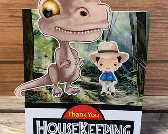 Un support pour embout de style tente d'entretien ménager sur le thème de Jurassic Park pour un séjour dans un complexe universel