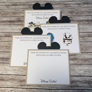 May include: Four cards with Mickey Mouse ears on the top. Each card has the text "Trade me or keep me, you get to choose which pins to collect on this" and "Disney Cruise!" printed on them.