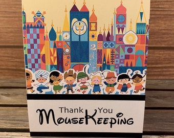 One Small World Themed Disney Mousekeeping tent style tip holder for Disney Resort Stays