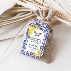 May include: Blue and white tile patterned thank you tag with a lemon illustration and the text "Thank you for showering our bride-to-be with love! Kimberly's Bridal Shower 10.14.24"