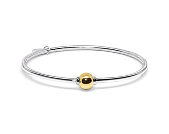 Made on Cape Cod. Bracelet made in Sterling Silver with a 14k Yellow Gold Ball.