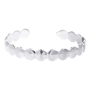 May include: Silver bracelet featuring a design of multiple seashells.