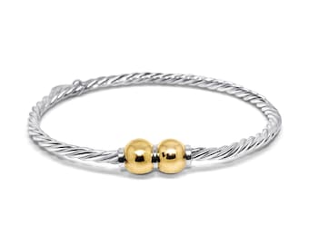 Made on Cape Cod. Bracelet made in Sterling Silver with Double 14K Yellow Gold Balls. (Braided Wire)