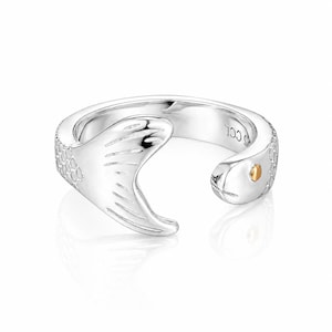May include: A silver-colored ring in the shape of a snake. The ring features a snake head with a gold-colored eye and a tail. The snake's body has a scale pattern. The ring is designed to wrap around the finger.