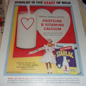 May include: A vintage advertisement for Borden's New Instant Starlac milk powder. The ad features a glass of milk with a red heart, a girl in a white dress, and a box of Starlac. The text reads "Starlac is the heart of milk" and lists the nutrients in Starlac, including proteins, B vitamins, and calcium.