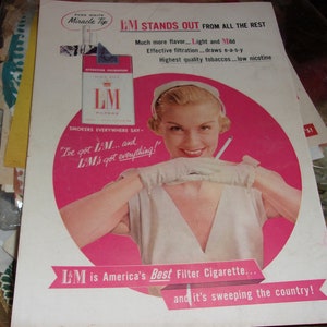 full page double-sided vintage advertisement for L&M Cigarettes on one side and Woodbury Dream Stuff make