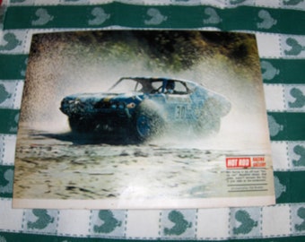 vintage picture of actor James Garner racing thru water in his "funny car"