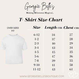 May include: White t-shirt with an oversized fit, next to a size chart. The chart lists sizes from 6-12 months to 11-12 years, with corresponding lengths and chest measurements in centimeters. The brand name "Georgie Belle's" is at the top.