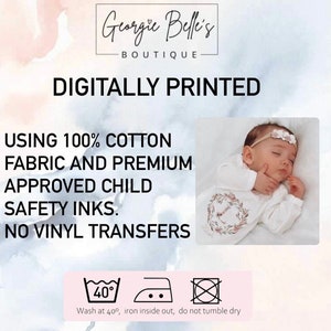 May include: Digitally printed baby onesie with a floral wreath design. The onesie is made from 100% cotton fabric and printed with child-safe inks. The text "Georgie Belle's Boutique" and "Digitally Printed" is visible at the top of the image. The text "Using 100% cotton fabric and premium approved child safety inks. No vinyl transfers" is visible below the onesie. The image also includes washing instructions: "Wash at 40&deg;, iron inside out, do not tumble dry."