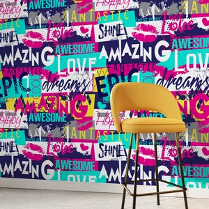 May include: A yellow bar stool with a black metal frame sits in front of a wall covered in colorful patterned wallpaper with words like "Amazing", "Love", "Fantastic", "Shine", and "Dreams".