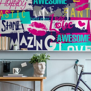 May include: A blue wall with a collage of colorful words and images. The words include "Happy", "Awesome", "Love", "Best Ever", "One Love", "Fantastic", "Shine", "Amazing", and "Love". The images include lips, hearts, and splatters of paint.