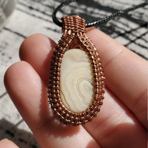 White banded Agate in copper weaving