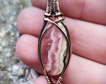Rhodochrosite Gemstone Pendant Wrapped in Polished Woven Copper Wire Wrapping