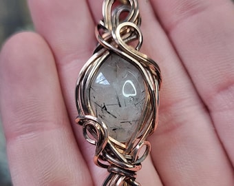 Rutilated Quartz in Swirling Polished Copper