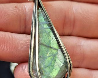 Sterling silver pendant with a faceted marquis labradorite