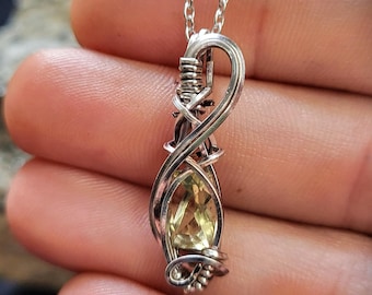 Golden citrine pendant in silver plated wire pendant