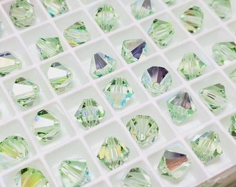 8 mm Chrysolite AB Swarovski Crystal Article 5328 Koraliki Bicone, 12 szt.