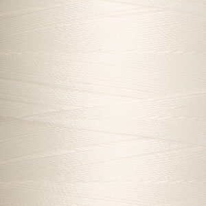 May include: A close-up of a spool of white thread.