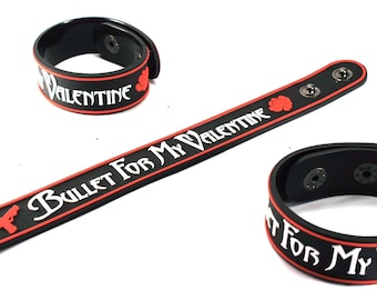 May include: Black wristbands with red trim and white text that reads "Bullet For My Valentine" and "Valentine". One wristband is long and flat, and two are circular. A red gun graphic is on the long wristband.