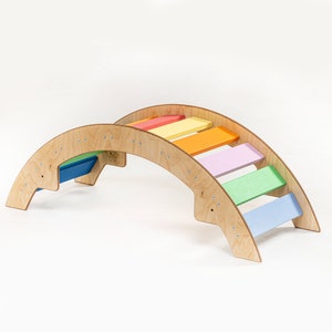 Handcrafted Montessori climbing arches and rockers made from high-quality wood
Montessori rocking play device for toddlers
Montessori arch, Montessori rocker, Climbing toy
Montessori climber
Baby rocker
Pikler triangle toy
Pikler arch
Wooden toys