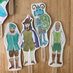 May include: Five illustrated character cutouts on sticks. The characters are a blue fish with a green turtle shell, a man with a green and white striped shirt, a man with a brown and green shirt, a man with a blue and green shirt, and a man with a green and white shirt. The sticks have the names of the characters written on them: Caliban, Antonio, Gonzalo, Miranda, and Sebastian.