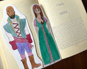 May include: A hand-drawn illustration of two characters from the play Othello. The first character is a man with dark skin, wearing a blue and red outfit. The second character is a woman with long brown hair, wearing a green and pink dress. The text "Othello" is visible in the background.