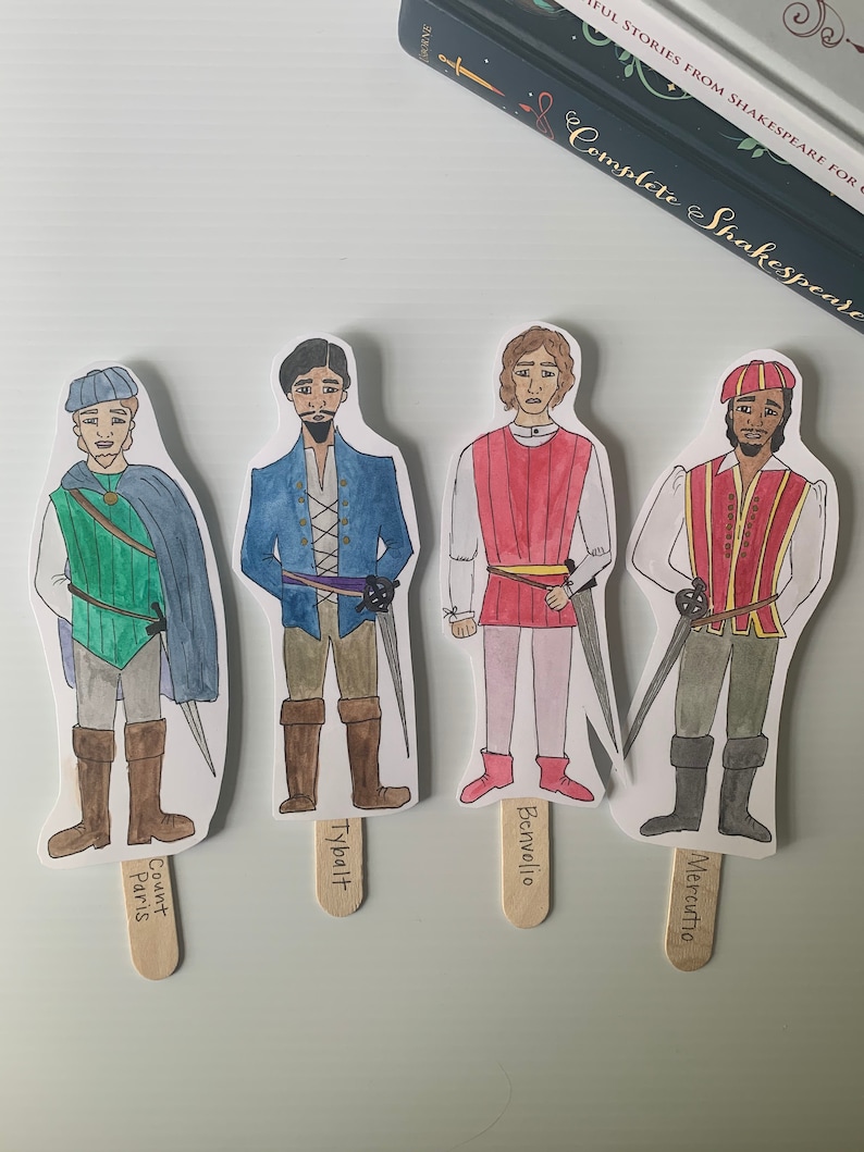 May include: Four paper character cutouts from Shakespeare's Romeo and Juliet. The characters are Tybalt, Mercutio, Benvolio, and Count Paris. Each character is illustrated with watercolor and has a popsicle stick attached to the bottom.