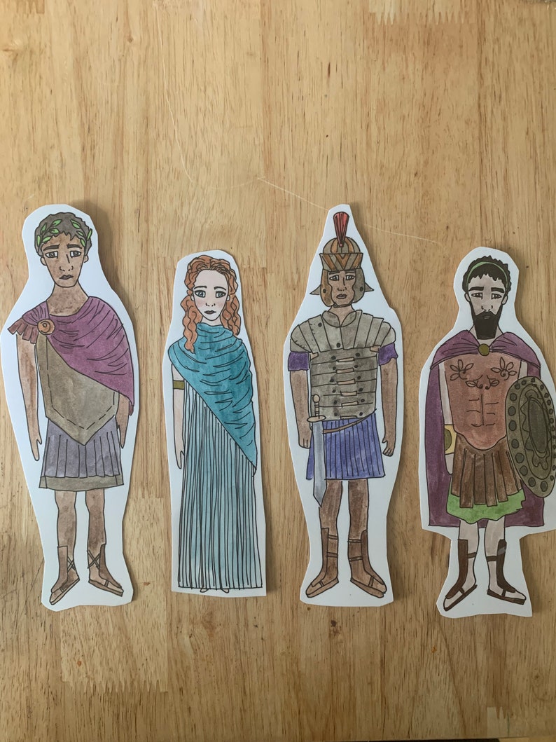 May include: Four paper dolls depicting Roman figures. The figures are wearing traditional Roman clothing, including tunics, togas, and armour. The dolls are hand-drawn and coloured in a cartoon style.