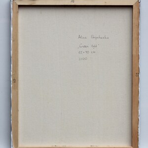 May include: The back of a framed canvas painting with the artist's signature, title, size, and date. The signature reads "Alisa Ovchpenko" and the title is "Green light". The size is 85 x 70 cm and the date is 2020.