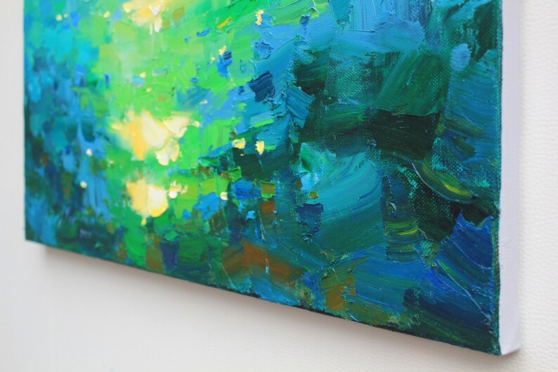 May include: Abstract painting with thick brushstrokes in shades of green, blue, and yellow. The painting has a textured surface and a white border.
