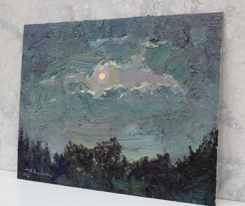 May include: An original oil painting depicting a night landscape. The artwork features a full moon peeking through the clouds, with a dark forest silhouette in the foreground. The painting is signed and dated 2023.