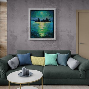 May include: A dark green sectional sofa with a variety of throw pillows in shades of blue, green, and yellow. The sofa is positioned in front of a gray wall with a framed painting of a moonlit lake scene.