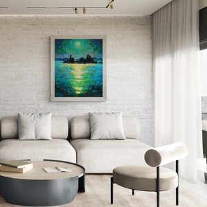 May include: A white brick wall with a framed painting of a moonlit lake scene. The painting is above a white couch with pillows and a round coffee table. A beige chair with a rolled back is in the foreground.
