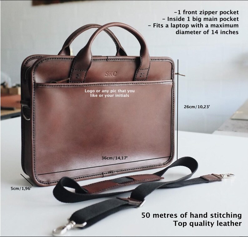 May include: Brown leather briefcase with a top handle and adjustable shoulder strap. The bag measures 36cm wide by 26cm tall. It features a front zipper pocket and a large main pocket that can fit a laptop up to 36cm in diameter. The bag is made of top quality leather and has 50 metres of hand stitching.
