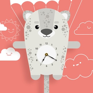 May include: A whimsical wall clock shaped like a cartoon bear with a parachute, set against a coral background. The bear is light grey with dark grey spots and a clock face. Smiling clouds and a sun are also featured.