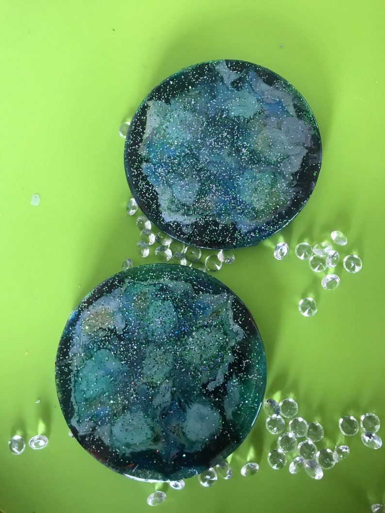 Pair of green glitter abstract floral coasters