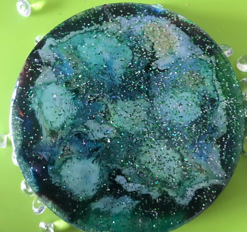 Pair of green glitter abstract floral coasters
